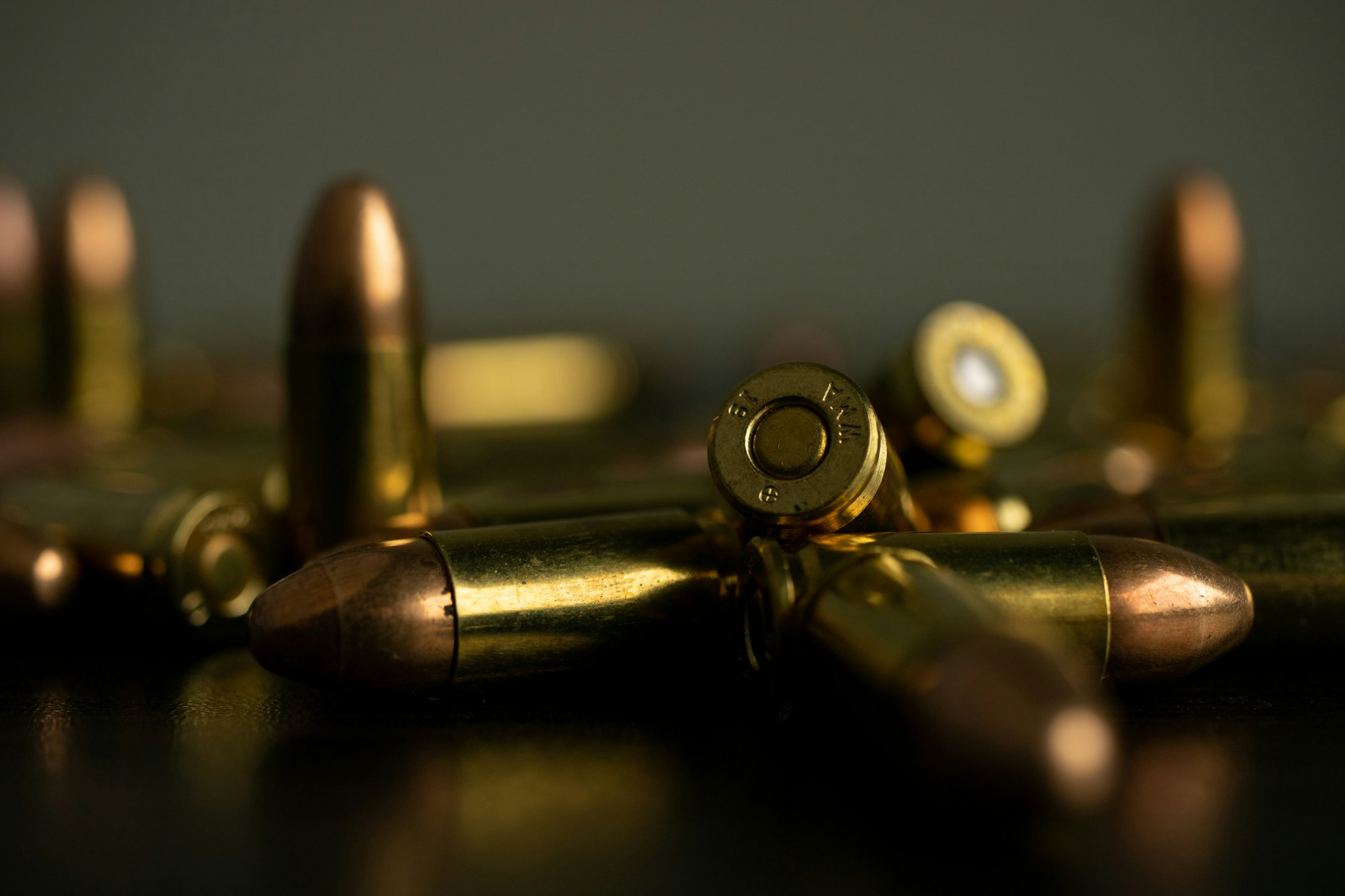 Brass cartridges on a dark surface