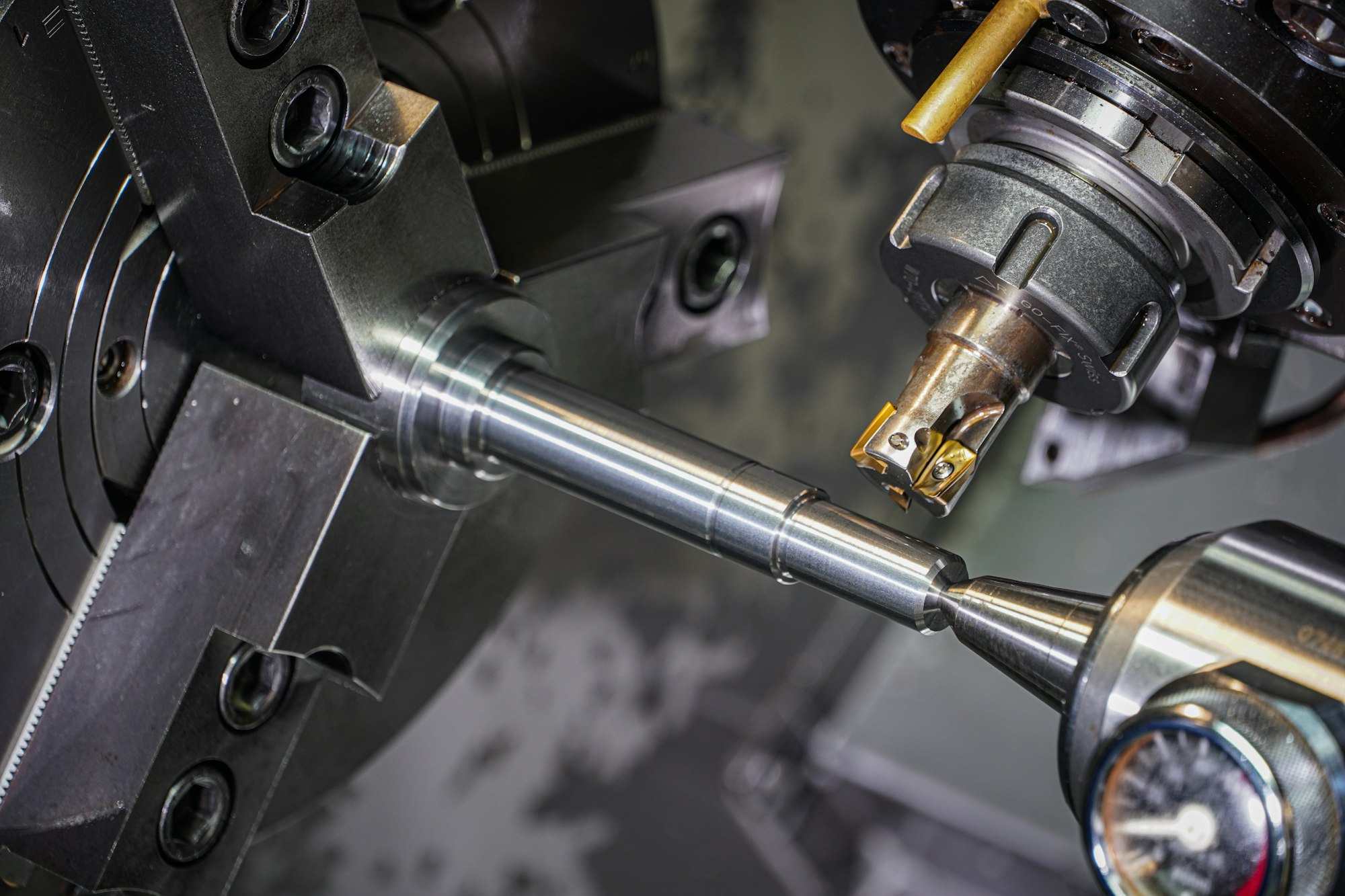 Steel part being machined on a lathe