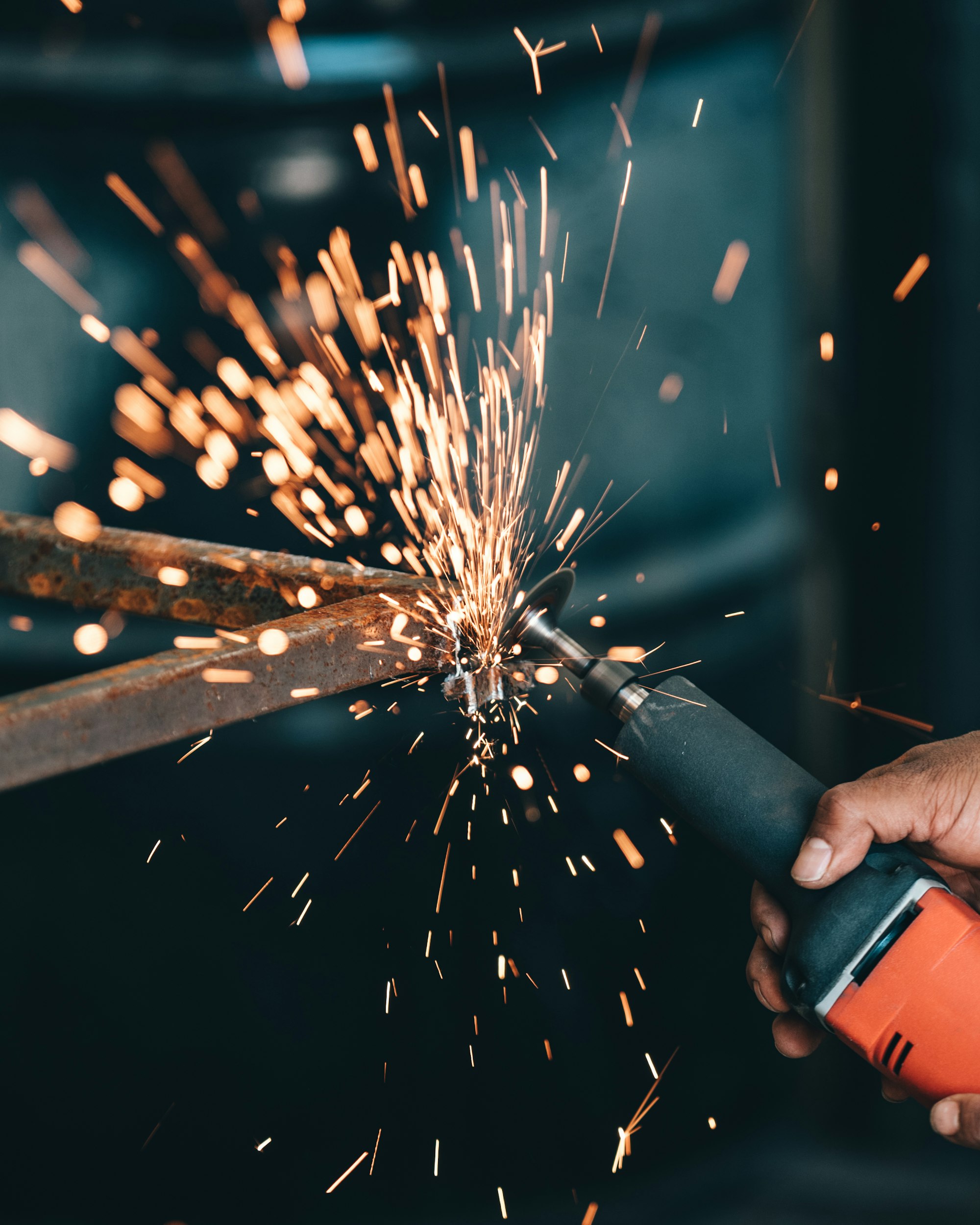 Sparks flying from an angle grinder cutting steel